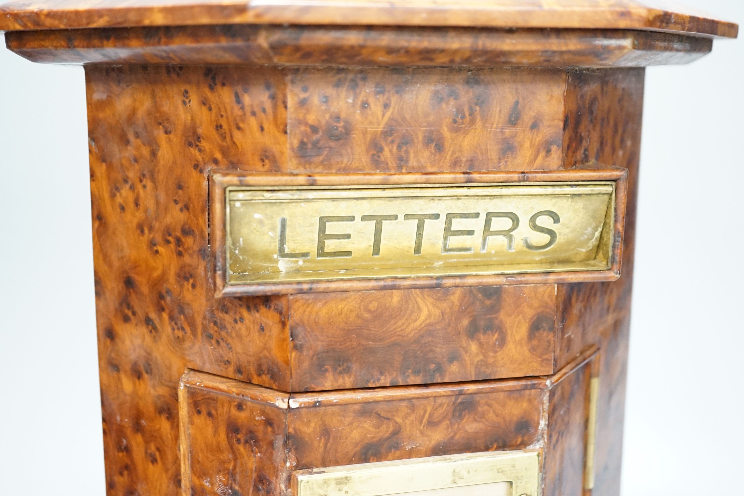 A Victorian-style amboyna octagonal country house post box, 34 cms high.